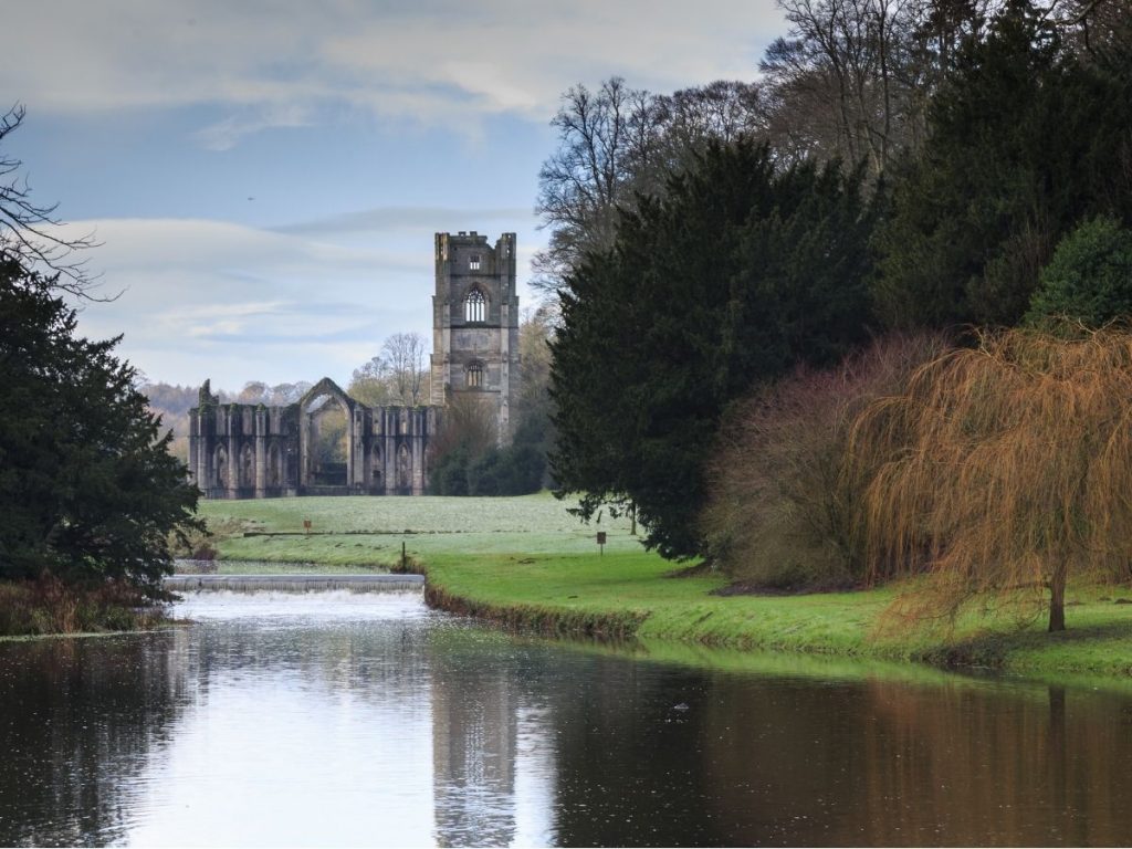Fountains Abbey overlooking water